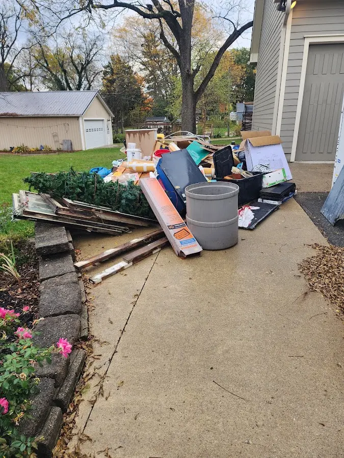 Dumpster being loaded with debris for Commercial Dumpster Rental in McKees Rocks